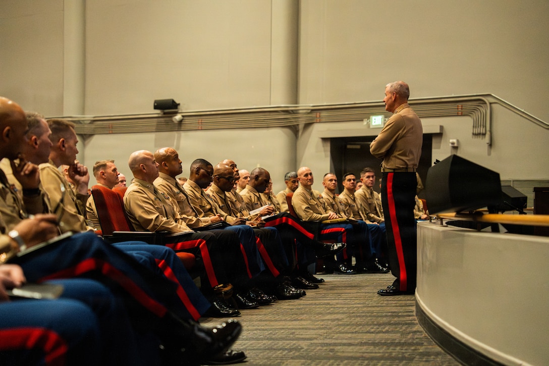 The 38th Assistant Commandant of the Marine Corps, Gen. Bradford J. Gering, right, gives a speech following the National Operations and Training Symposium and National Officer Selection Officer Training Symposium awards ceremony at Marine Corps Recruit Depot San Diego, California, Dec. 10, 2025. Marine Corps Recruiting Command organized the fiscal year 2026 NOTS and NOSOTS to conduct command-wide professional development, recognize superior performance in FY2025, and provide subordinate commands with information necessary to conduct recruiting operations in FY2026. (U.S. Marine Corps photo by Cpl. Francisco Angel)