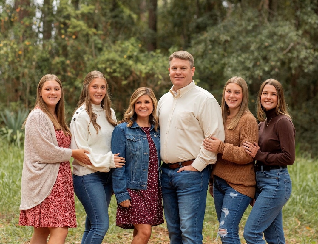 A Picture of a family. Four Ladies and one Man.