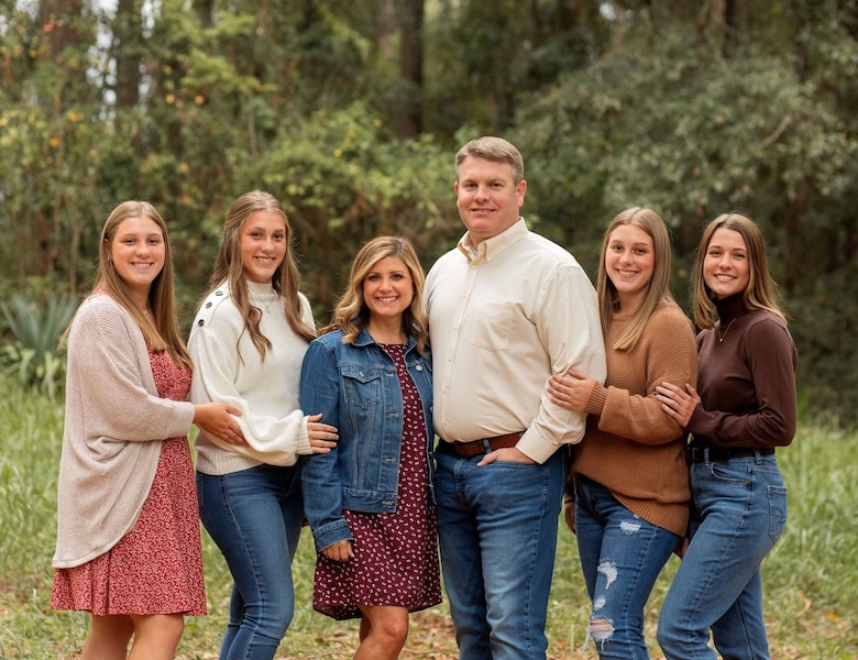 A Picture of a family. Four Ladies and one Man.