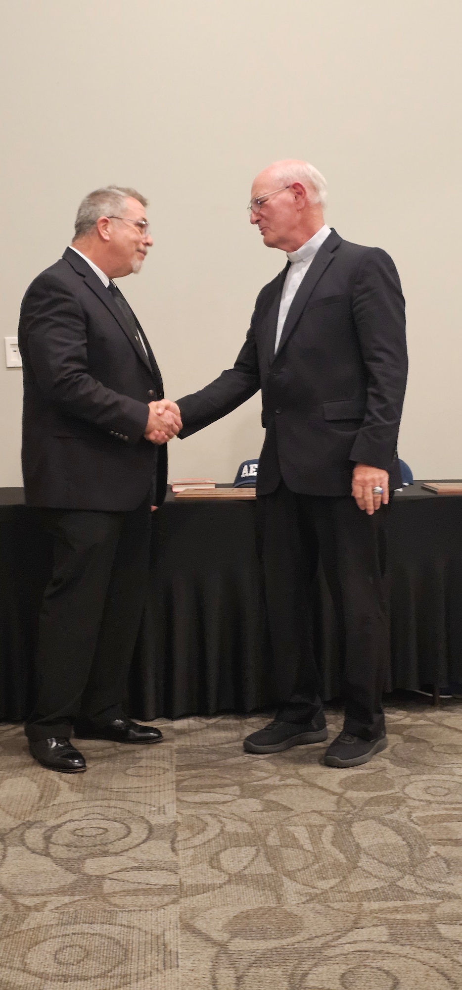 John Hopf, left, shakes hands with retired Air Force Gen. Mike Wiedemer, chair of the Arnold Engineering Development Complex Fellows Program, following his induction as an AEDC Fellow during the recent Arnold Community Council annual banquet. Hopf, selected as an AEDC Technical Fellow, for his work in improving the productivity, efficiency, and safety of nearly every wind tunnel at AEDC, with an emphasis on captive trajectory systems. Hopf was one of three Fellows inducted during the banquet. The AEDC Fellows program, established in 1989, recognizes AEDC personnel who have made substantial and exceptionally distinguished contributions to the nation’s aerospace ground testing capability. (Courtesy photo)