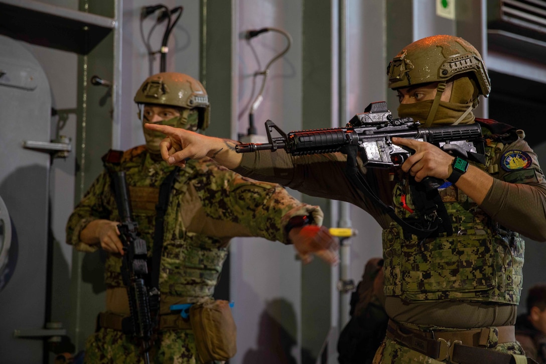 HAIFA, Israel (Dec. 10, 2025) U.S. Coast Guardsmen, assigned to the Maritime Engagement Team, perform a visit, board, search, and seizure training during Exercise Intrinsic Defender 2025 in Haifa, Israel. Intrinsic Defender is a bilateral exercise designed to strengthen relationships, enhance interoperability and support freedom of navigation and the free flow of commerce in the U.S. Central Command area of responsibility. (U.S. Army photo by Private First Class Nicolas Uker)