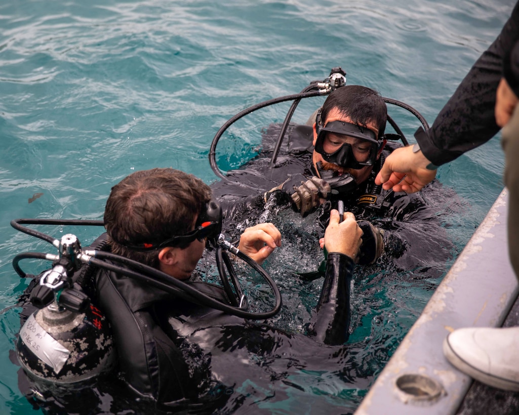 HAIFA, Israel (Dec. 8, 2025) U.S. Sailors, assigned to Explosive Ordnance Disposal Mobile Unit 6, conduct equipment checks prior to a dive during Exercise Intrinsic Defender 2025 in Haifa, Israel. Intrinsic Defender is a bilateral exercise designed to strengthen relationships, enhance interoperability and support freedom of navigation and the free flow of commerce in the U.S. Central Command area of responsibility. (U.S. Army photo by Private First Class Nicolas Uker)