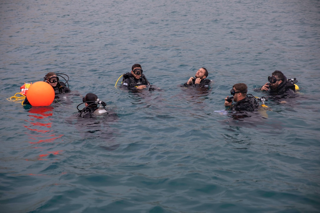 HAIFA, Israel (Dec. 8, 2025) U.S. Sailors, assigned to Explosive Ordnance Disposal Mobile Unit 6, prepare for a dive during Exercise Intrinsic Defender 2025 in Haifa, Israel. Intrinsic Defender is a bilateral exercise designed to strengthen relationships, enhance interoperability and support freedom of navigation and the free flow of commerce in the U.S. Central Command area of responsibility. (U.S. Army photo by Private First Class Nicolas Uker)