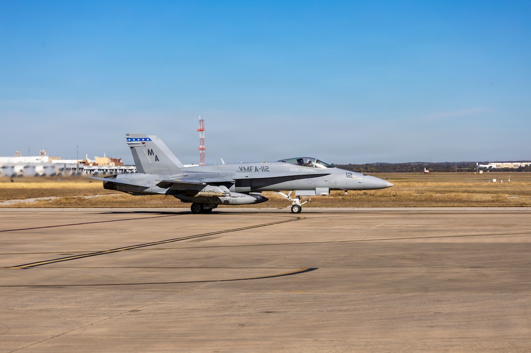 A U.S. Marine Corps F/A-18C Hornet aircraft with Marine Fighter Attack Squadron (VMFA) 112, Marine Aircraft Group 41, 4th Marine Aircraft Wing, taxis in preparation for take-off to conduct close air support training at Naval Air Station Joint Reserve Base Fort Worth, Texas, Dec. 9, 2025. The training serves to increase proficiency, validate ordinance handling procedures, and support joint fire support elements. (U.S. Marine Corps photo by Staff Sgt. Ethan M. LeBlanc)