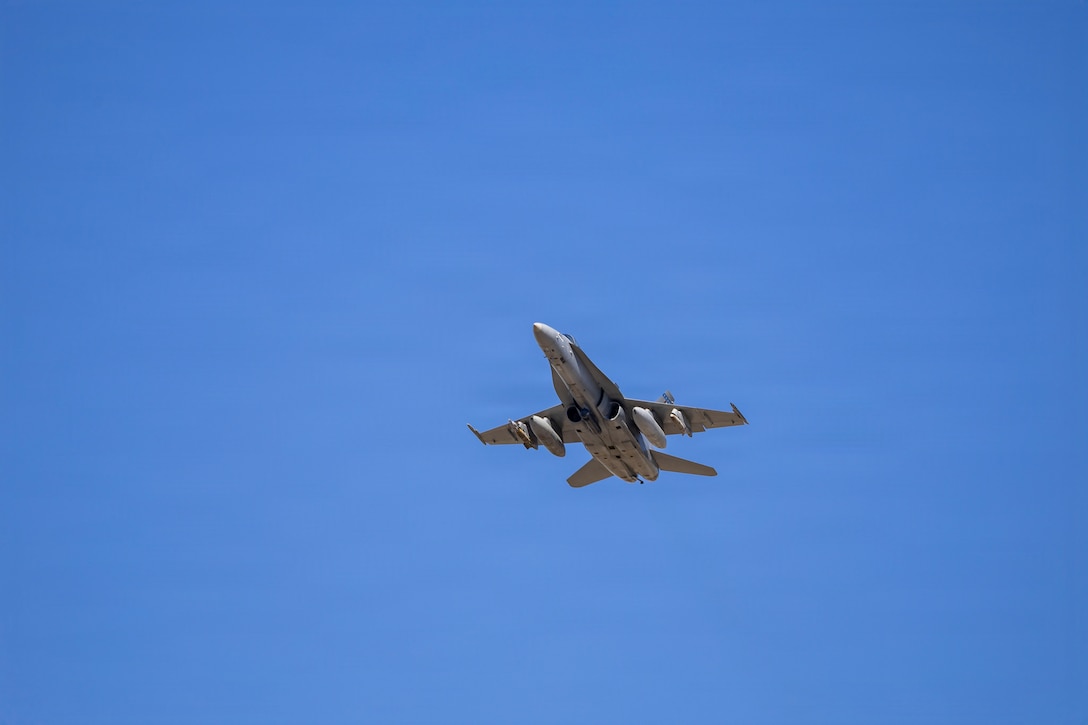 A U.S. Marine Corps F/A-18C Hornet aircraft with Marine Fighter Attack Squadron (VMFA) 112, Marine Aircraft Group 41, 4th Marine Aircraft Wing, takes off to conduct close air support training at Naval Air Station Joint Reserve Base Fort Worth, Texas, Dec. 9, 2025. The training serves to increase proficiency, validate ordinance handling procedures, and support joint fire support elements. (U.S. Marine Corps photo by Staff Sgt. Ethan M. LeBlanc)