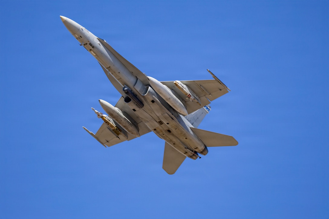 A U.S. Marine Corps F/A-18C Hornet aircraft with Marine Fighter Attack Squadron (VMFA) 112, Marine Aircraft Group 41, 4th Marine Aircraft Wing, takes off to conduct close air support training at Naval Air Station Joint Reserve Base Fort Worth, Texas, Dec. 9, 2025. The training serves to increase proficiency, validate ordinance handling procedures, and support joint fire support elements. (U.S. Marine Corps photo by Staff Sgt. Ethan M. LeBlanc)