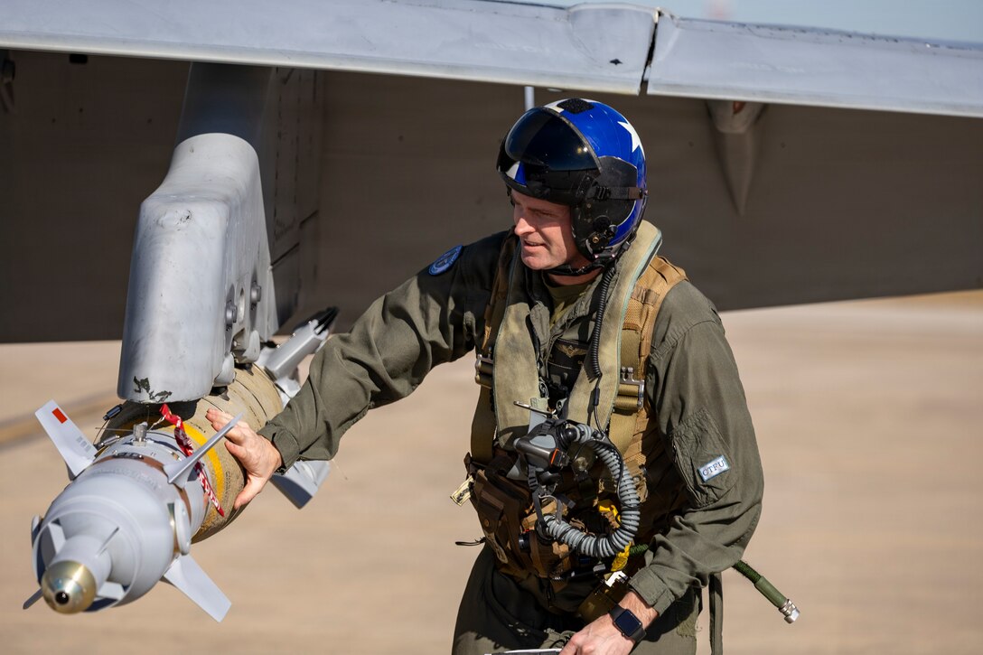 U.S. Marine Corps Maj. Jonathan Gilson, a pilot with Marine Fighter Attack Squadron (VMFA) 112, Marine Aircraft Group 41, 4th Marine Aircraft Wing, conducts final checks on an F/A-18C Hornet aircraft in preparation for close air support training at Naval Air Station Joint Reserve Base Fort Worth, Texas, Dec. 9, 2025. The training serves to increase proficiency, validate ordinance handling procedures, and support joint fire support elements. (U.S. Marine Corps photo by Staff Sgt. Ethan M. LeBlanc)