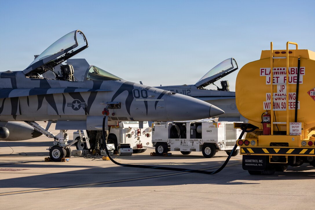 A U.S. Marine Corps F/A-18C Hornet aircraft with Marine Fighter Attack Squadron (VMFA) 112, Marine Aircraft Group 41, 4th Marine Aircraft Wing, refuels in preparation to conduct close air support training at Naval Air Station Joint Reserve Base Fort Worth, Texas, Dec. 9, 2025. The training serves to increase proficiency, validate ordinance handling procedures, and support joint fire support elements. (U.S. Marine Corps photo by Staff Sgt. Ethan M. LeBlanc)