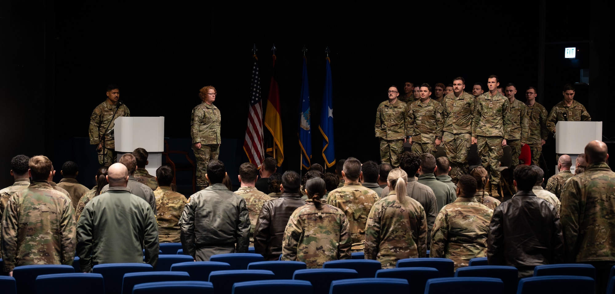 Team Ramstein members attend a ceremony where 18 86th Airlift Wing Airmen receive a Gallant Unit Citation at Ramstein Air Base, Germany, Dec. 5, 2025.