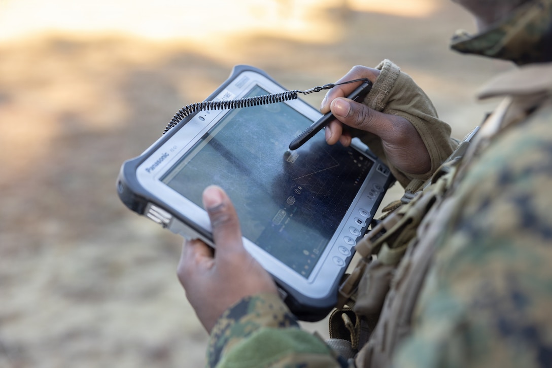 U.S. Marine Corps Cpl. Michael Russ, a logistics specialist with Combat Logistics Battalion 24, Combat Logistics Regiment 27, 2nd Marine Logistics Group, utilizes a SkyDio X2 to conduct route reconnaissance during a tactical patrol as part of a battalion field exercise at Marine Corps Base Camp Lejeune, North Carolina, Dec. 9, 2025. Marines with CLB-24 conducted patrols and sUAS operations to sustain proficiency in training and readiness standards and establish baseline individual skills. (U.S. Marine Corps photo by Lance Cpl. Talan Werner)