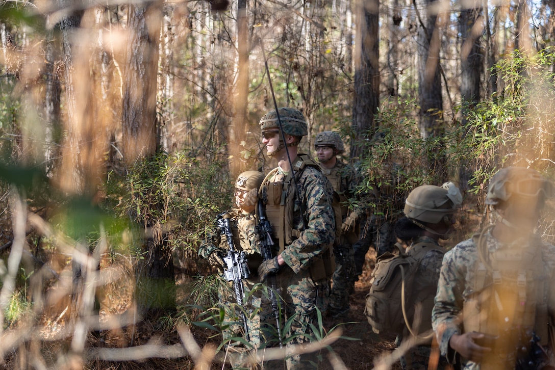 U.S. Marines with Combat Logistics Battalion 24, Combat Logistics Regiment 27, 2nd Marine Logistics Group, pause during a tactical patrol as part of a battalion field exercise at Marine Corps Base Camp Lejeune, North Carolina, Dec. 9, 2025. Marines with CLB-24 conducted patrols and sUAS operations to sustain proficiency in training and readiness standards and establish baseline individual skills. (U.S. Marine Corps photo by Lance Cpl. Talan Werner)