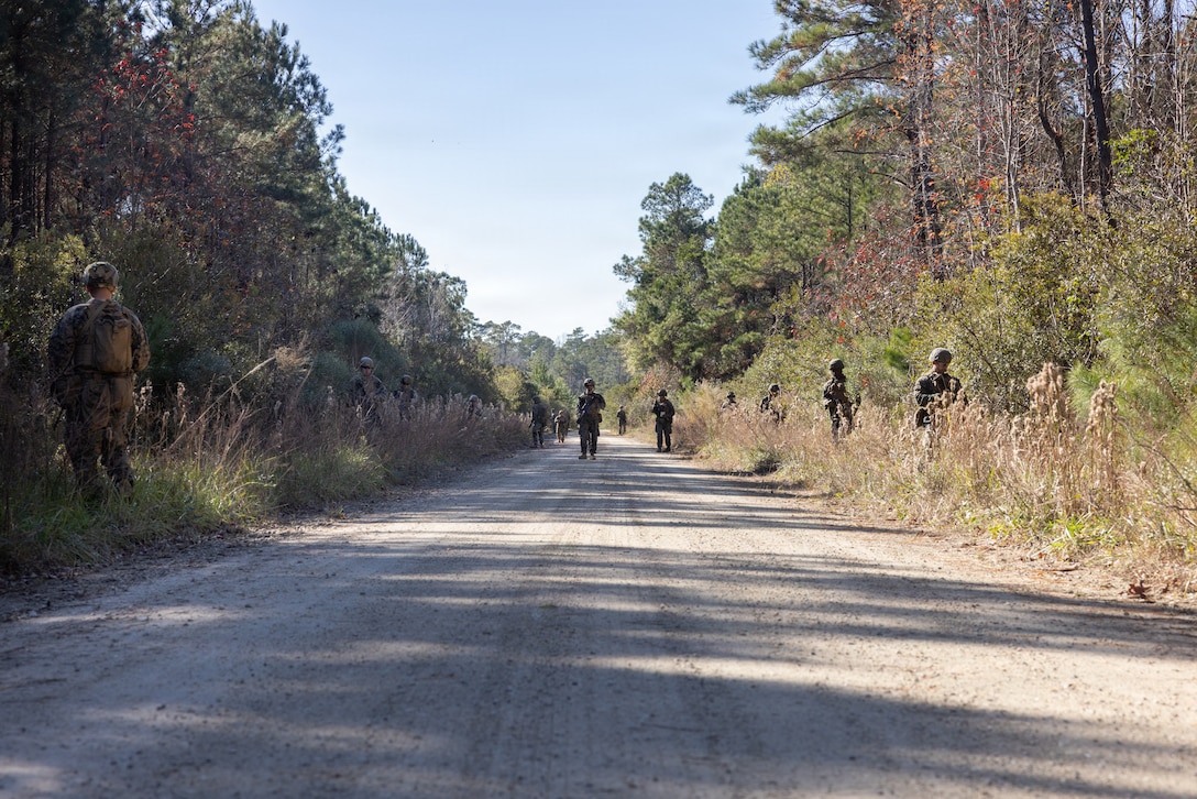 U.S. Marines with Combat Logistics Battalion 24, Combat Logistics Regiment 27, 2nd Marine Logistics Group, conduct a tactical patrol as part of a battalion field exercise at Marine Corps Base Camp Lejeune, North Carolina, Dec. 9, 2025. Marines with CLB-24 conducted patrols and sUAS operations to sustain proficiency in training and readiness standards and establish baseline individual skills. (U.S. Marine Corps photo by Lance Cpl. Talan Werner)