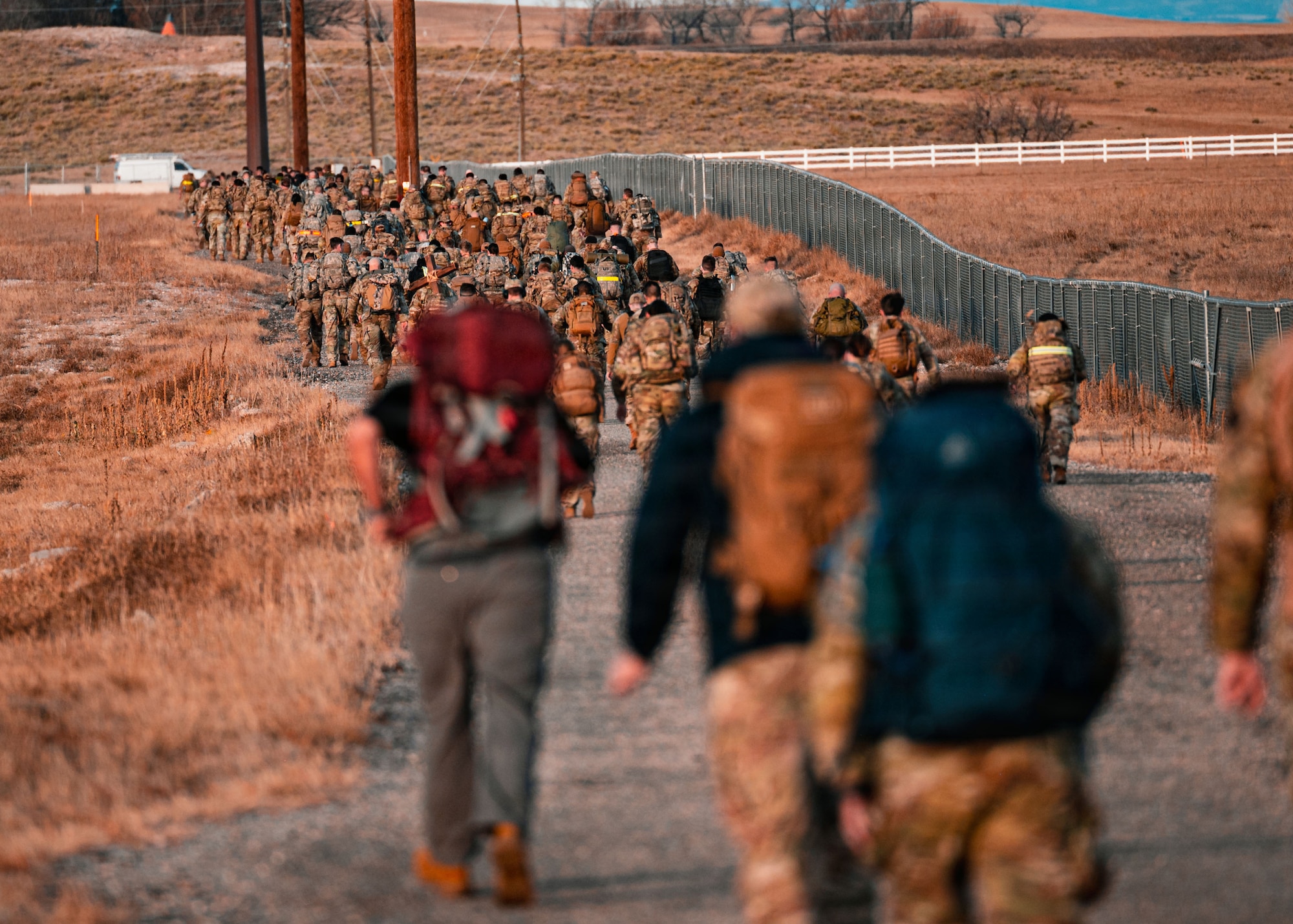 To earn the Norwegian Foot March badge, participants must finish the 18.64-mile event while carrying a 24.25-pound ruck and meeting time standards set by the Norwegian military.