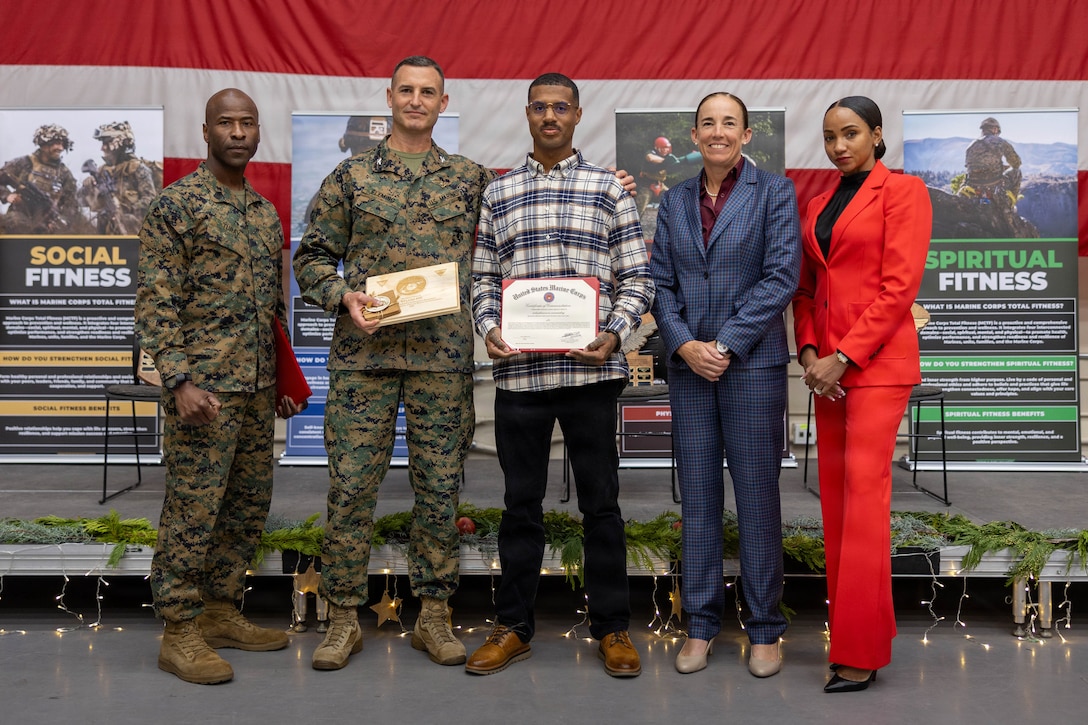 From left to right, U.S. Marine Corps Col. Fleming, commanding officer of Marine Aircraft Group 39, 3rd Marine Aircraft Wing, Sgt. Maj.Turay, sergeant major of MAG 39, 3rd MAW, Religious Program Specialist Petty Officer 2nd Class Mr. Hill, a religious program specialist, Col. Houser, the commanding officer of MCAS Camp Pendleton, Sgt. Maj. Smith-Leavey, sergeant major of MCAS Camp Pendleton, stand for a photo at the 9th annual Joint Leadership Education Conference at MCAS Camp Pendleton, California, Dec. 10, 2025. The conference is a two-day event featuring panels and presentations on leadership, personal readiness, professional development, and strategic growth. The conference also included an awards ceremony, a series of focused discussions ranging from trauma informed leadership and relationship dynamics to financial readiness, tuition assistance, and health fundamentals. (U.S Marine Corps photo by Lance Cpl.  Estrada)