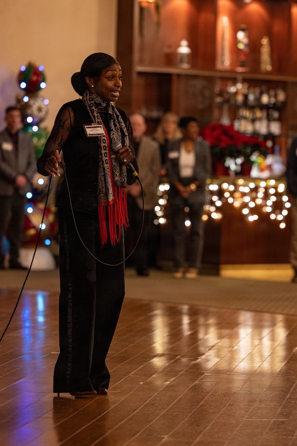 U.S. Marine Corps Sgt. Maj. Cook, the senior enlisted leader of Marine Corps Installations West, gives remarks during the 2025 Holiday Buffet and Cocktail Reception at Marine Corps Base Camp Pendleton, California, Dec. 11, 2025. U.S. Marine Corps Brig. Gen. Brown, the commanding general of Marine Corps Installations West, hosted the event to kick off the holiday season and build camaraderie between MCIWEST and its surrounding units and organizations. (U.S. Marine Corps photo by Cpl.  Akamelu)