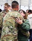 Angie Bateman hugs her son, Illinois Army National Guard Staff Sgt. Mitch Bateman, upon his return from deployment.