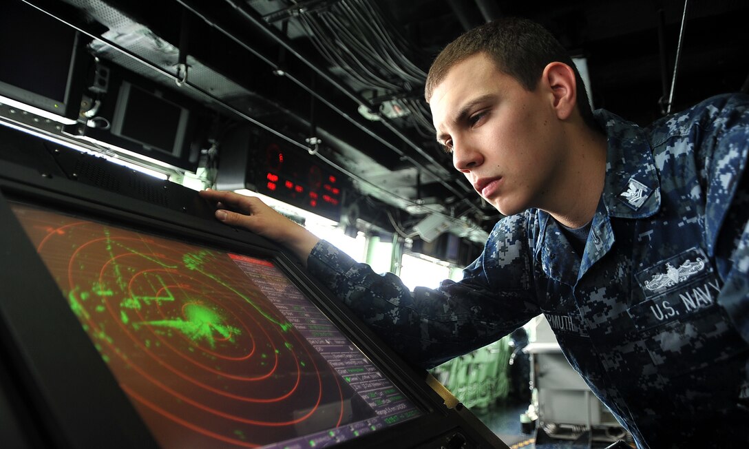 NORFOLK, Va. – Operations Specialist 2nd Class Michael R. Gutermuth reads the SPS 73 radar on the bridge of the amphibious transport dock USS San Antonio (LPD 17). San Antonio is preparing to depart Naval Station Norfolk to provide Humanitarian Aid/ Disaster Relief in the wake of Hurricane Sandy. (U.S. Navy photo by Mass Communication Specialist 3rd Class Zachary S. Welch/Released)