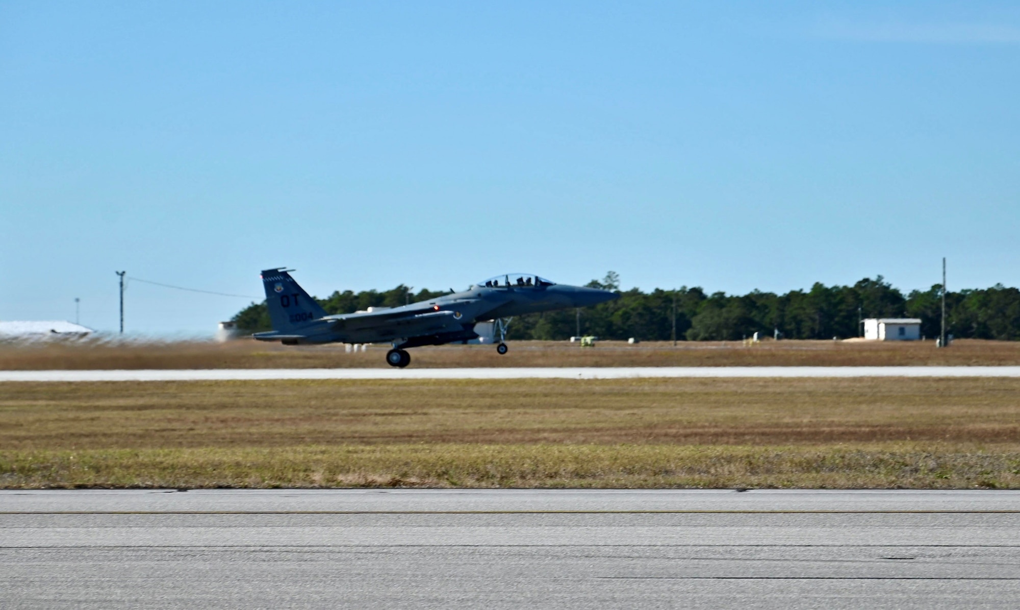 U.S. Air Force Maj. Aaron Eshkenazi, F-15EX Test Director for the 84th Test and Evaluation Squadron, performs preflight procedures for the F-15EX with Under Secretary of the Air Force Matt Lohmeier, at Eglin Air Force Base, Florida, December 11, 2025. During his visit, Lohmeier gained valuable insights from the 84th TES and 85th TES to help inform future decisions regarding the platform. The future F-15 fleet will complement 5th generation aircraft, bringing substantial additional capacity for over-sized long-range fires, sensors, and electronic warfare capabilities to defend critical locations in highly contested areas. (U.S. Air Force photo by Capt. M. Ryan Goss)