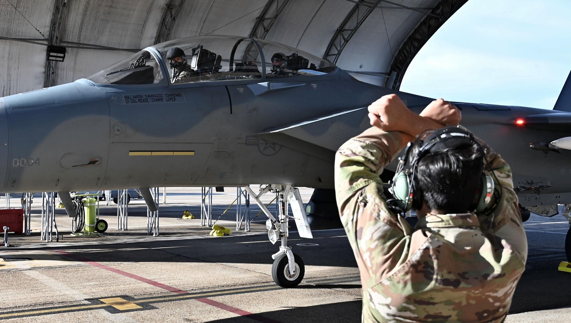 U.S. Air Force Maj. Aaron Eshkenazi, F-15EX Test Director for the 84th Test and Evaluation Squadron, performs preflight procedures for the F-15EX with Under Secretary of the Air Force Matt Lohmeier, at Eglin Air Force Base, Florida, December 11, 2025. During his visit, Lohmeier gained valuable insights from the 84th TES and 85th TES to help inform future decisions regarding the platform. The future F-15 fleet will complement 5th generation aircraft, bringing substantial additional capacity for over-sized long-range fires, sensors, and electronic warfare capabilities to defend critical locations in highly contested areas. (U.S. Air Force photo by Capt. M. Ryan Goss)