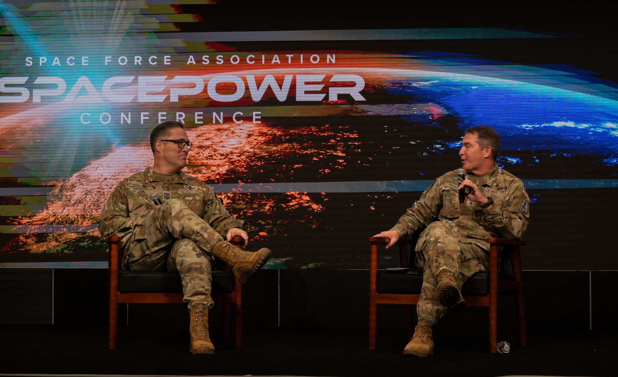 U.S. Space Force Lt. Gen. Gregory J. Gagnon, commander of USSF Combat Forces Command, and Chief Master Sgt. Michael J. Rozneck, CFC senior enlisted leader, conducted a firside chat at the Space Force Assosiation's 2025 Spacepower conference, Dec. 12th, 2025. During the chat they discussed forging a resilient force and people being a priority to CFC's mission success. CFC’s participation in Spacepower Conference 2025 reinforces the command’s commitment to transparency, engagement, and the advancement of professional discourse within the space community. As the U.S. Space Force approaches its sixth anniversary, the conversation underscored both the progress made and the work ahead to ensure America’s space warfighters remain Always Ready, Always Innovative, Always Above. (U.S. Space Force photo by John Ayre)