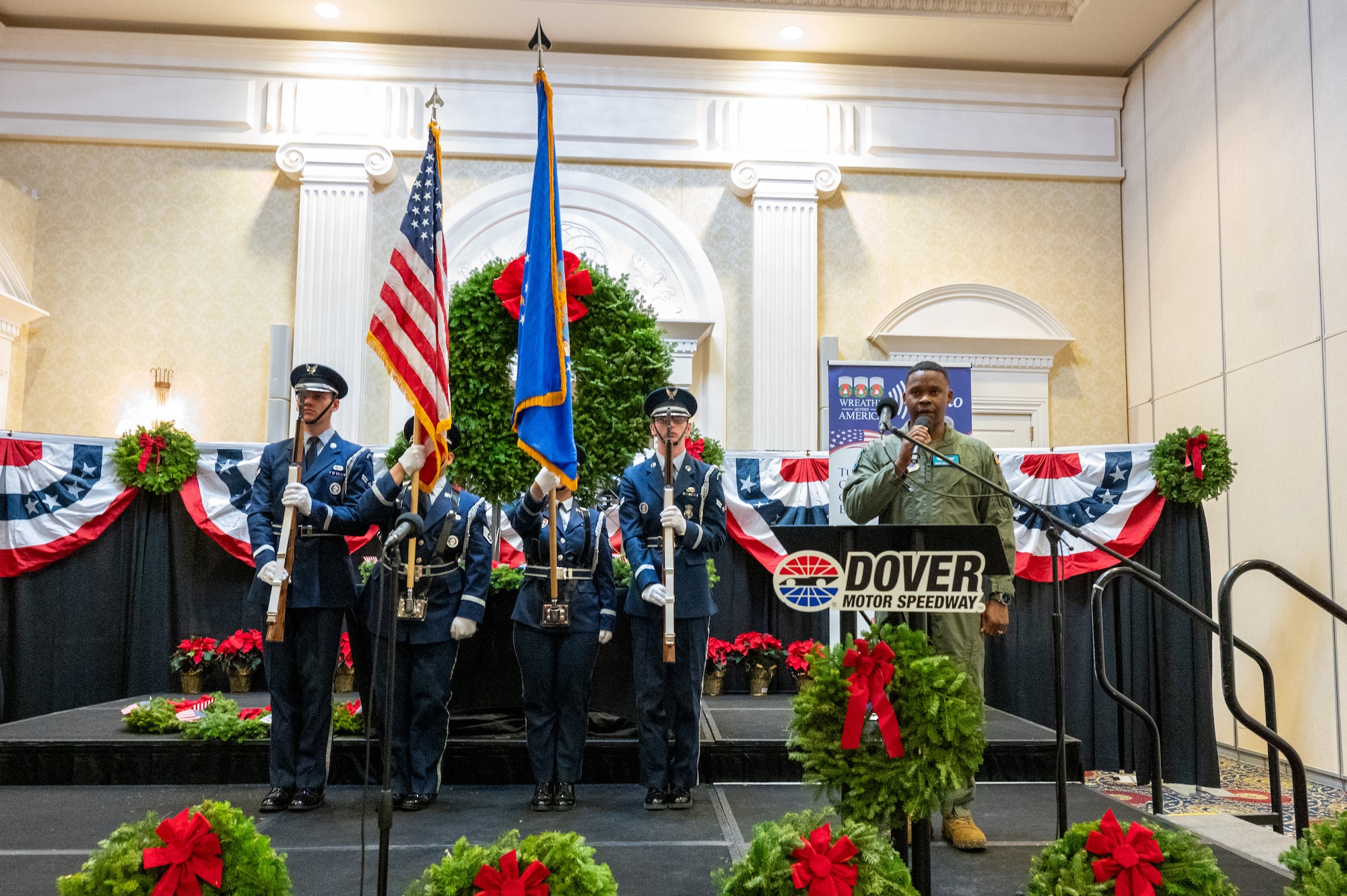 U.S. Air Force Senior Master Sgt. Mecardo Morales, 436th Medical Group senior enlisted leader, sings the national anthem during a Wreaths Across America event in Dover, Delaware, Dec. 11, 2025. Delaware was one of seven stops along the route from Maine to Arlington National Cemetery where volunteers will place holiday wreaths on the graves of thousands of American veterans. (U.S. Air Force photo by Mauricio Campino)