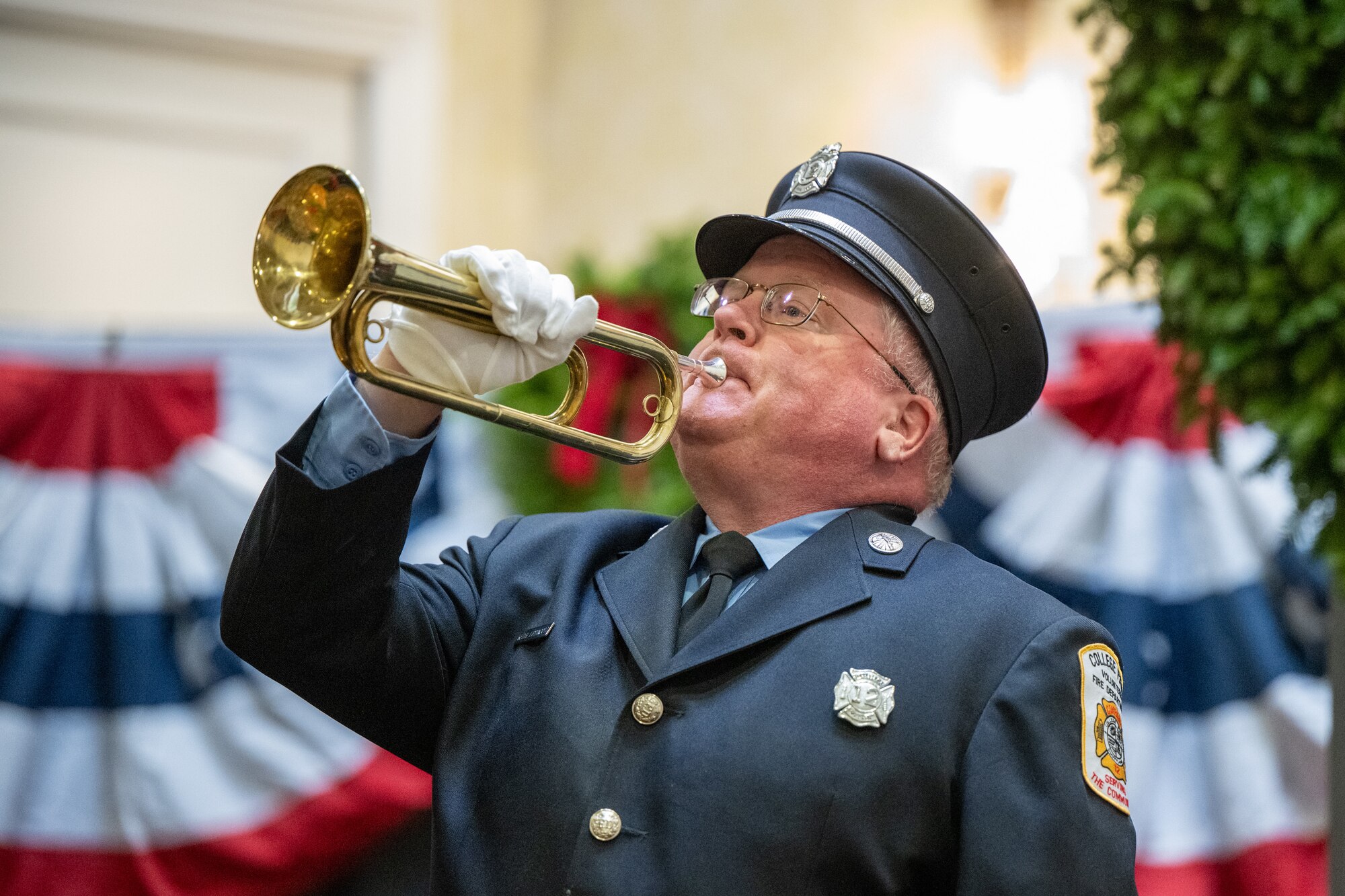 Keith Lippincott, Bugles Across America bugler, plays Taps at the conclusion of a Wreaths Across America event in Dover, Delaware, Dec. 11, 2025. The ceremony was attended by Team Dover base leadership as well as veterans, volunteers and families of fallen service members. (U.S. Air Force photo by Mauricio Campino)