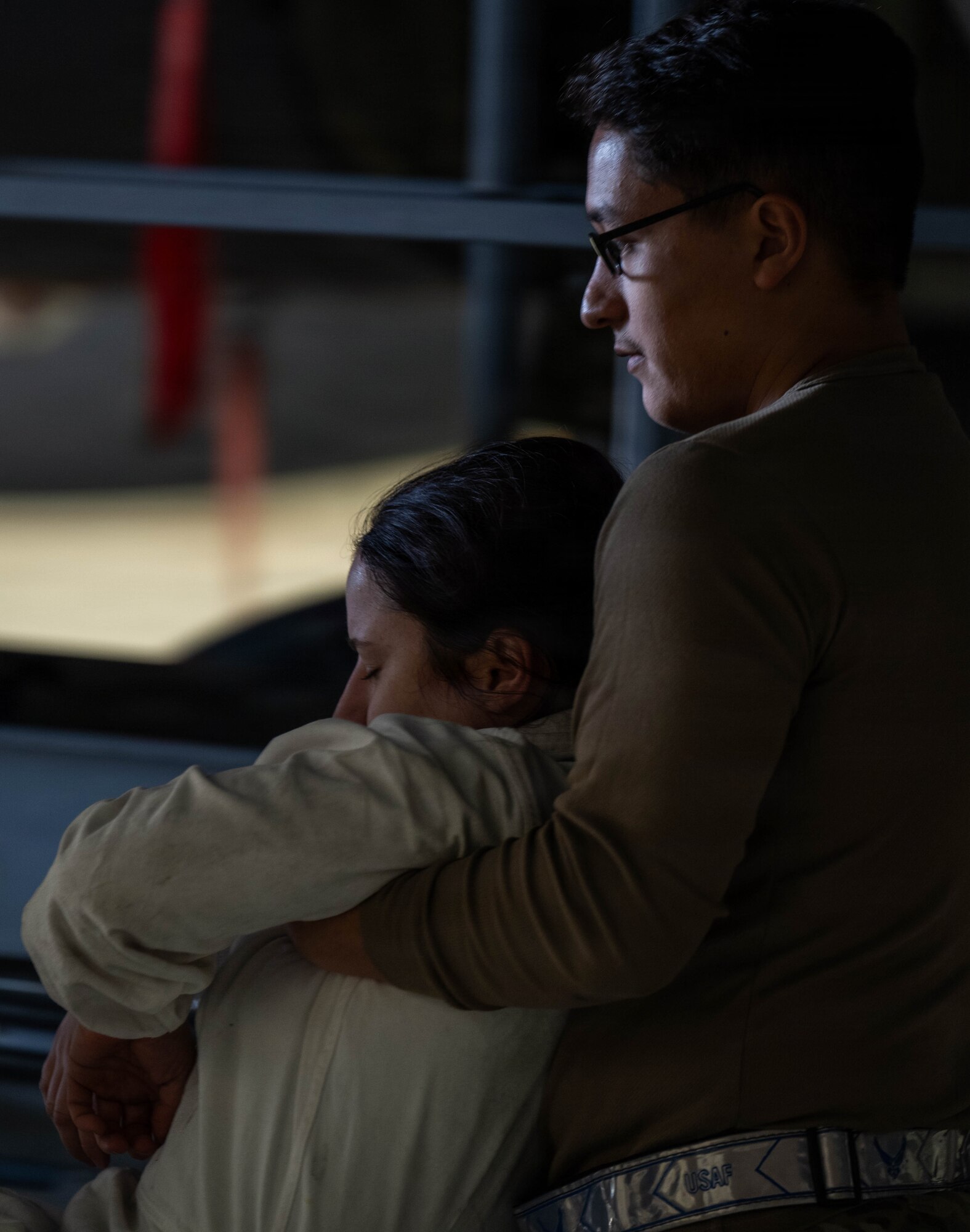 A1C Adrian Leos, 22nd Aircraft Maintenance Squadron fuels system specialist, carries a simulated casualty away from the immediate area following a simulated fuel cell extraction