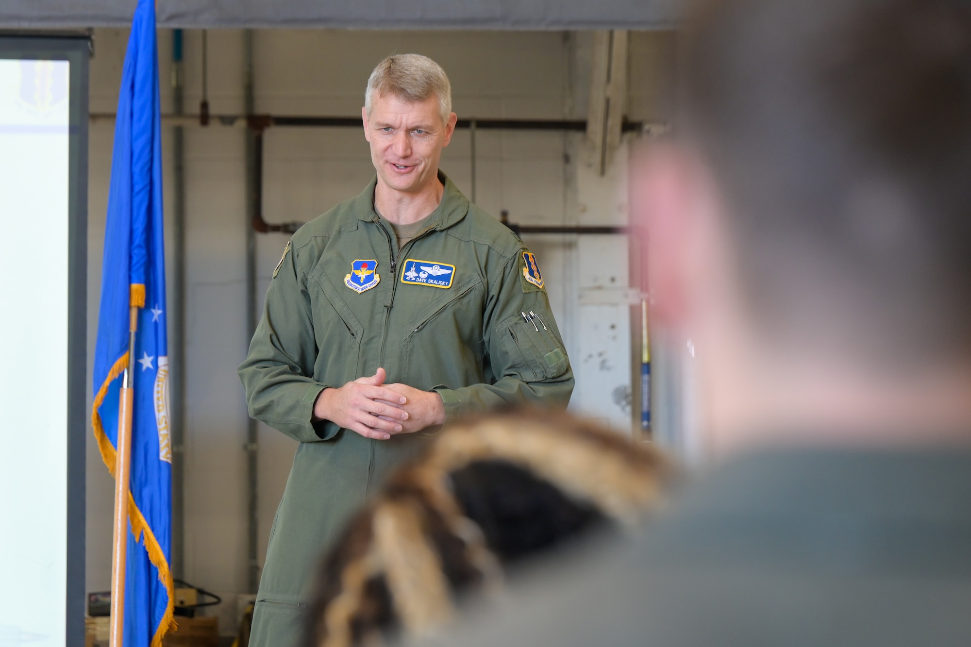 A photo of airman talking.