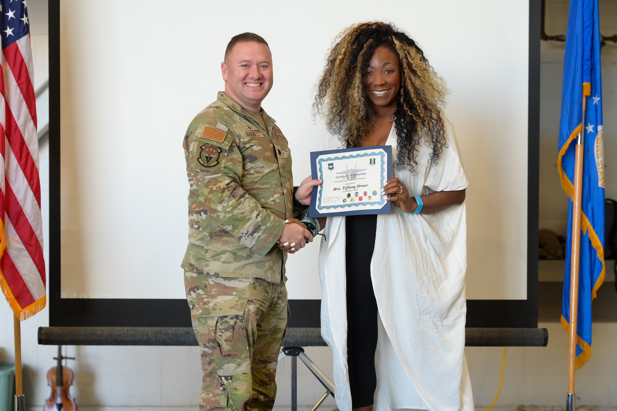 A photo of people posing.