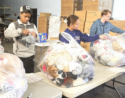 Corpsmen care in the community… Junior Enlisted Association hospital corpsmen from Navy Medicine Readiness Training Command Bremerton volunteered at a local toy drive which delivers directly to children receiving care in Puget Sound–area hospitals (courtesy photo)