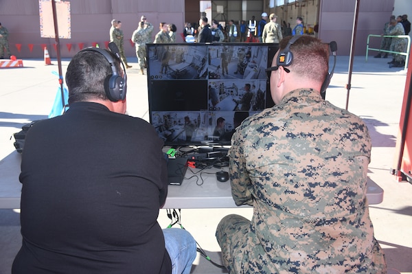 Technicians monitor patient care inside one of the two Rapid Emergency Medical (REM) Pod/Units used during a  mass casualty response drill on Naval Air Station North Island.   Members of the Military Sealift Command (MSC) hospital ship USNS Mercy (T-AH 19) Medical Treatment Facility (MTF) along with Marines from the Expeditionary Medical Facility, 4th Marine Medical Battalion and the Marine Corps Warfighting Lab participated in the drill as part of the larger, multi-service exercise, Steel Knight 2025, held at Marine Base Camp Pendleton, and tested the MTF’s ability to triage, treat and transport multiple simulated patients during a crisis.