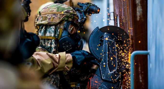 U.S. Army Soldiers from the 5-20 Infantry Battalion, 1-2 Stryker Brigade Combat Team, 7th Infantry Division, prepare to breach a facility at Twin Bridges Training Area, Yangju-si, Republic of Korea, on Mar. 12, 2025.