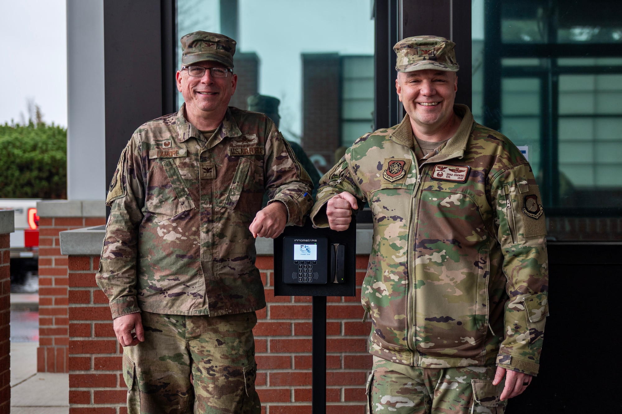 From left, U.S. Air Force Col. Robert Lamore, 92nd Mission Support Group commander, and Col. Chad Cisewski, 92nd Air Refueling Wing commander, stand with the new Fast Pass System at Fairchild Air Force Base, Washington, Dec. 15, 2025. The Fast Pass System marked a major step towards streamlining base access and easing peak-hour congestion. (U.S. Air Force photo by Senior Airman Morgan St Marks)