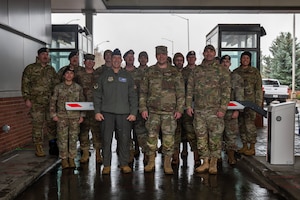 U.S. Air Force 92nd Air Refueling Wing leadership and 92nd Security Forces Squadron Airmen gather for a group photo for the grand opening of the Fast Pass System at Fairchild Air Force Base, Washington, Dec. 15, 2025. The system’s installation reflects a broader effort within the 92nd SFS to modernize base defense operations. (U.S. Air Force photo by Senior Airman Morgan St Marks)