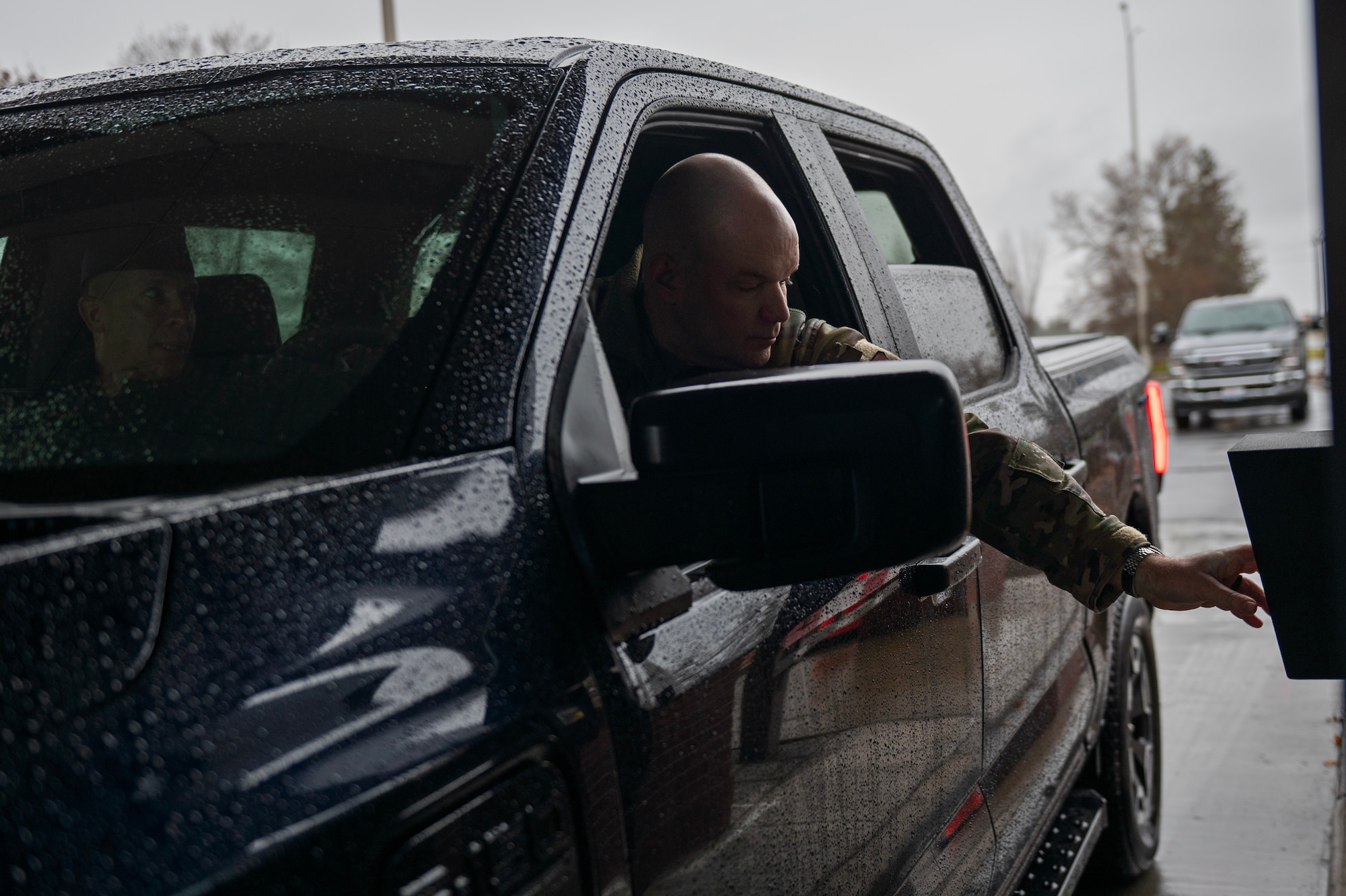 U.S. Air Force Col. Chad Cisewski, 92nd Air Refueling Wing commander, is the first person to use the Fast Pass System at Fairchild Air Force Base, Washington, Dec. 15, 2025. All personnel with trusted traveler privileges can register for the system using their Common Access Card at the visitor control center. (U.S. Air Force photo by Senior Airman Morgan St Marks)
