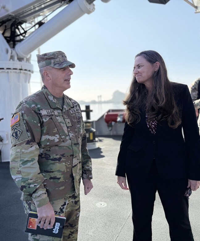 Brig. Gen. John Lloyd, U.S. Army Corps of Engineers South Pacific Division commander, left, speaks with Suzanne Plezia, managing director of the Port of Long Beach, right, during a boat tour of the port Dec. 2 in Long Beach, California.