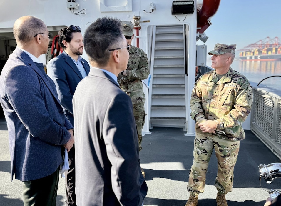 Brig. Gen. John Lloyd, U.S. Army Corps of Engineers South Pacific Division commander, right, speaks with leaders and subject-matter experts with the Port of Long Beach and USACE during a boat tour of the port Dec. 2 in Long Beach, California.
