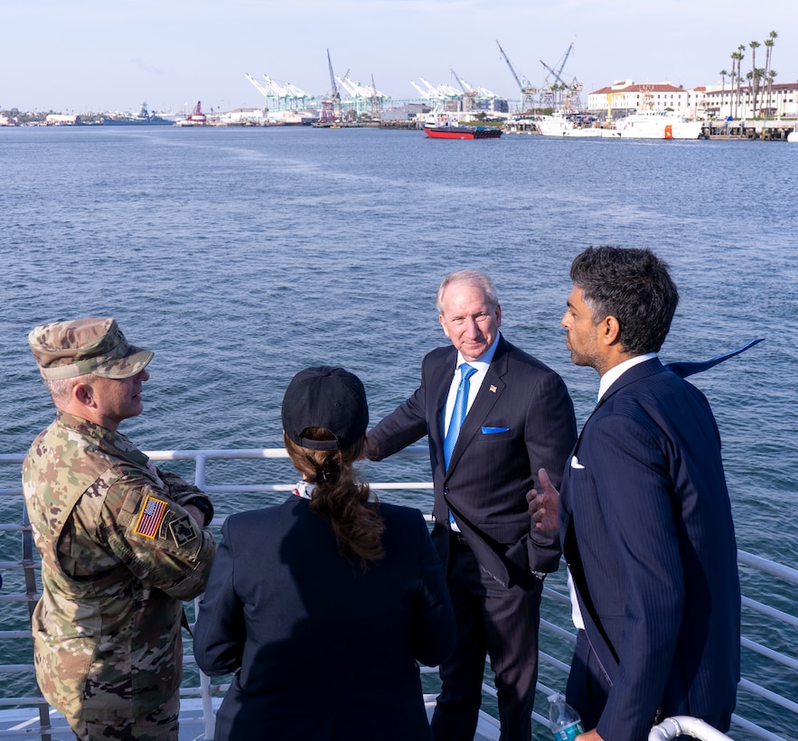 Brig. Gen. John Lloyd, U.S. Army Corps of Engineers South Pacific Division commander, left, speaks with officials with the Port of Los Angeles during a boat tour of the port Dec. 2 in San Pedro, California.