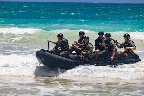 U.S. Army Soldiers representing the 11th Airborne Division during the U.S. Army Pacific Best Squad Competition row during the Zodiac Relay event, July 15, 2025,