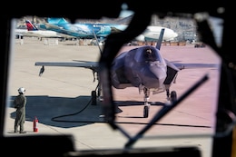 A U.S. Marine Corps F-35B Lightning II aircraft with Marine Fighter Attack Squadron (VMFA) 214, Marine Aircraft Group 13, 3rd Marine Aircraft Wing, receives fuel during an air-delivered ground refueling mission as part of exercise Steel Knight 25 at Southern California Logistics Airport, Victorville, California, Dec. 12, 2025. ADGR enables 3rd MAW to sustain distributed aviation operations by delivering fuel to forward locations without reliance on established infrastructure.  Steel Knight is an annual exercise that strengthens the Navy-Marine Corps team's ability to respond forward, integrate across domains, and sustain Marine Air-Ground Task Force readiness. (U.S. Marine Corps photo by Cpl. Nikolas Mascroft)