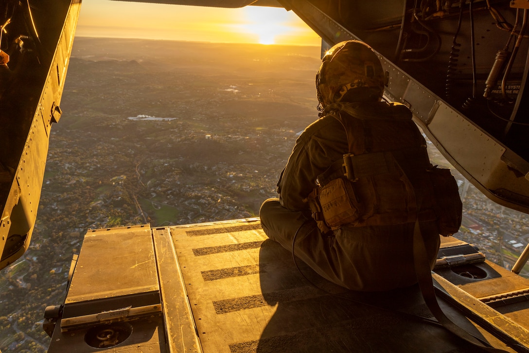 U.S. Marine Corps Gunnery Sgt. Derek Levi, an MV-22B Osprey crew chief with Marine Medium Tiltrotor Squadron (VMM) 161, Marine Aircraft Group 16, 3rd Marine Aircraft Wing, sits in an Osprey assigned to VMM-161, following an air-delivered ground refueling and troop transport mission from San Clemente Island to a Helicopter Outlying Landing Field in support of exercise Steel Knight 25 at Marine Corps Base Camp Pendleton, California, Dec. 9, 2025. With its speed, range, and vertical lift capability, the Osprey allows aviation assets and ground forces to reposition quickly to forward locations while sustaining momentum and extending the reach of the Marine Air-Ground Task Force in dynamic environments. Steel Knight is an annual exercise that strengthens the Navy-Marine Corps team's ability to respond forward, integrate across domains, and sustain Marine Air-Ground Task Force readiness. (U.S. Marine Corps photo by Cpl. Renee Gray)