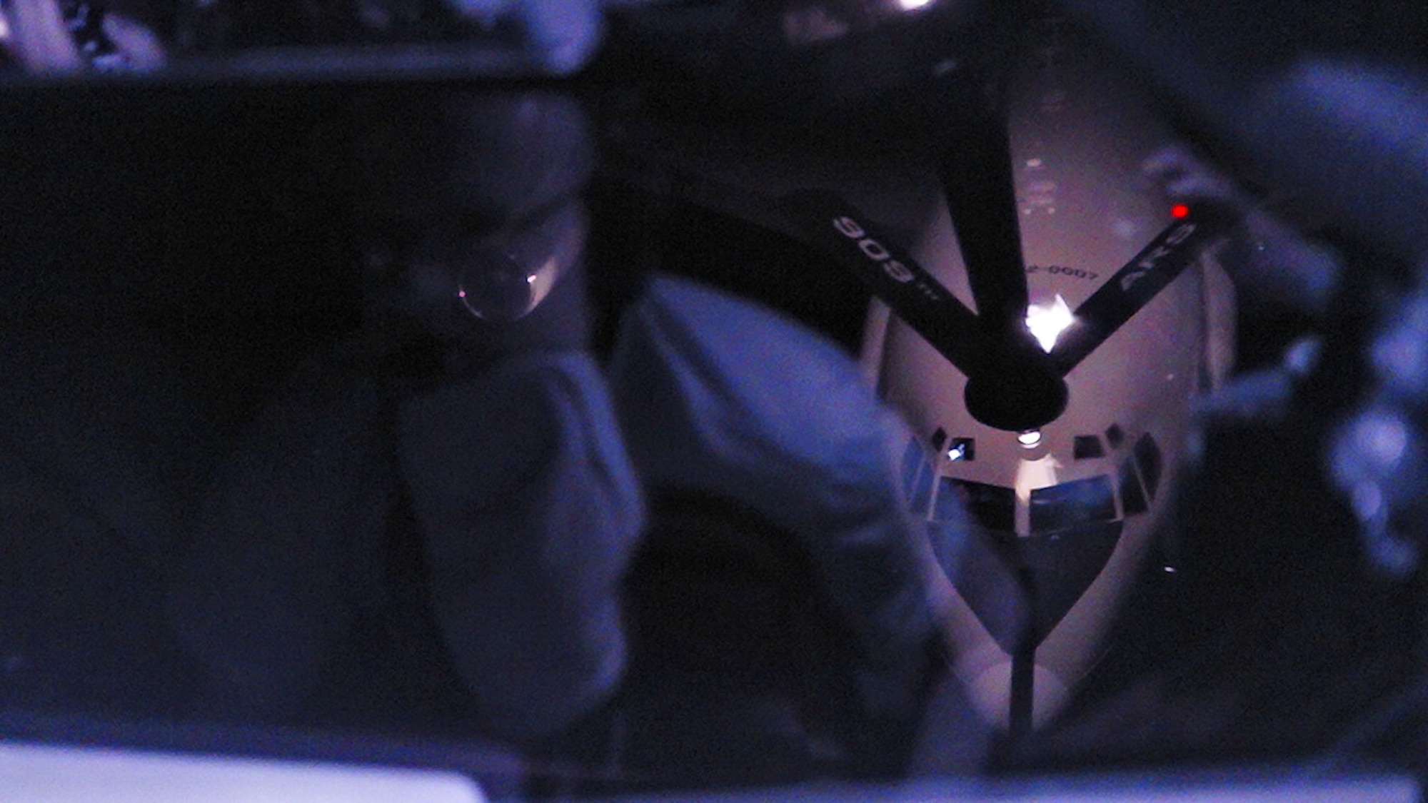 A U.S. Air Force E-3 Sentry assigned to the 961st Airborne Air Control Squadron, approaches a KC-135 Stratotanker assigned to the 909th Air Refueling Squadron for nighttime aerial refueling over the Pacific Ocean, Sept. 24, 2025.