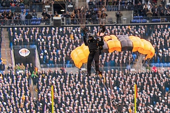Sgt. 1st Class Ryan Reis of the U.S. Army Parachute Team lands for a demonstration parachute jump on 13 December 2025 for the Army Navy game.