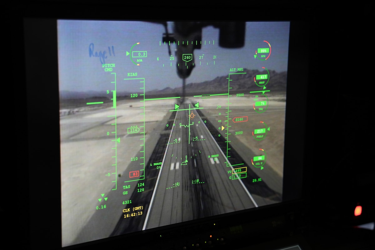 A screen shows a runway.
