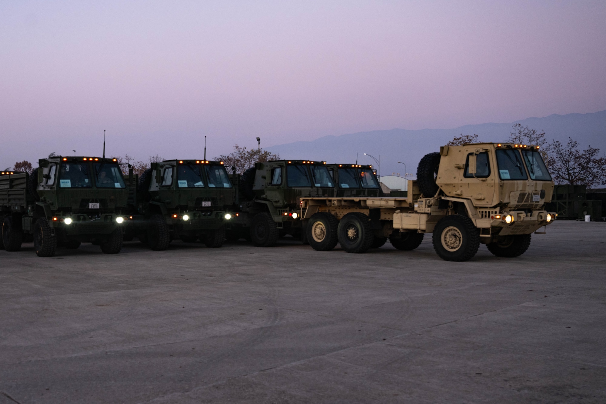 A group of trucks are parked.
