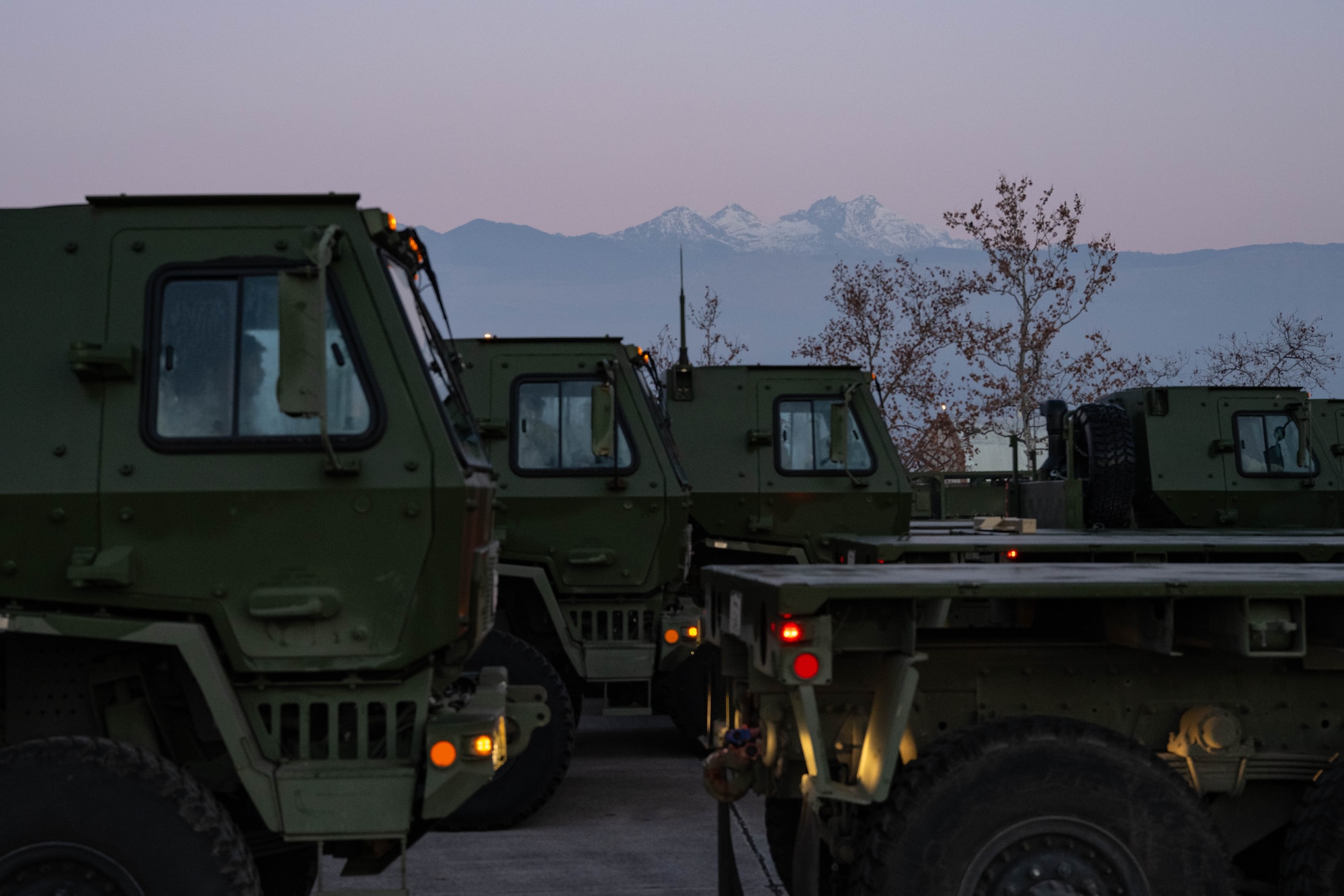 A group of trucks are parked.
