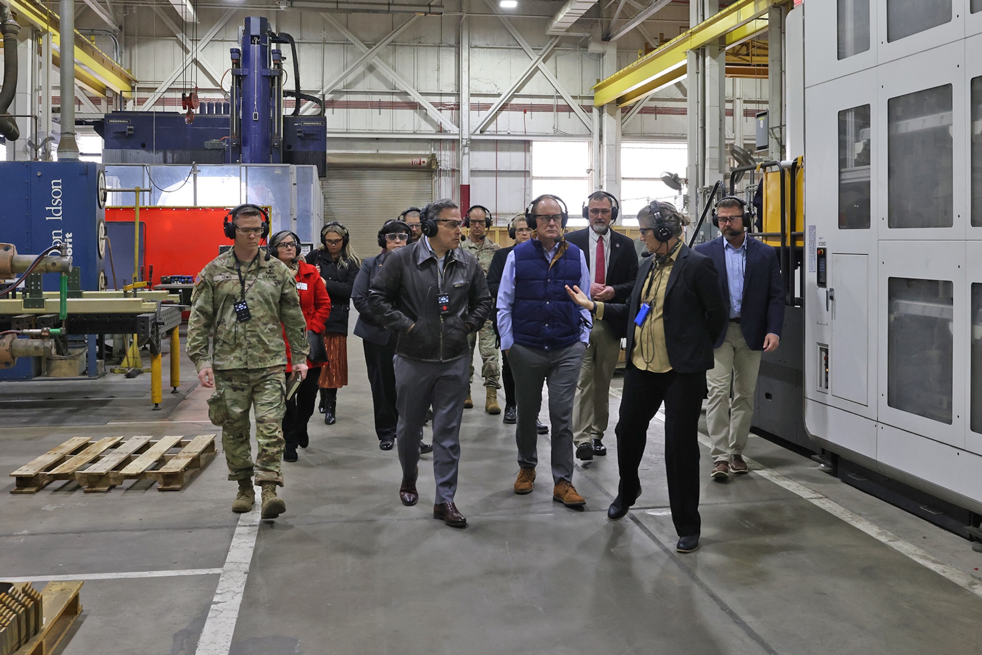 Kate Williams, Directorate of Strategic Management director, provides a mission and capabilities overview to Sen. Dave McCormick, Rep. John Joyce and staff members inside a maintenance facility during their visit to Letterkenny Army Depot, Dec. 6.