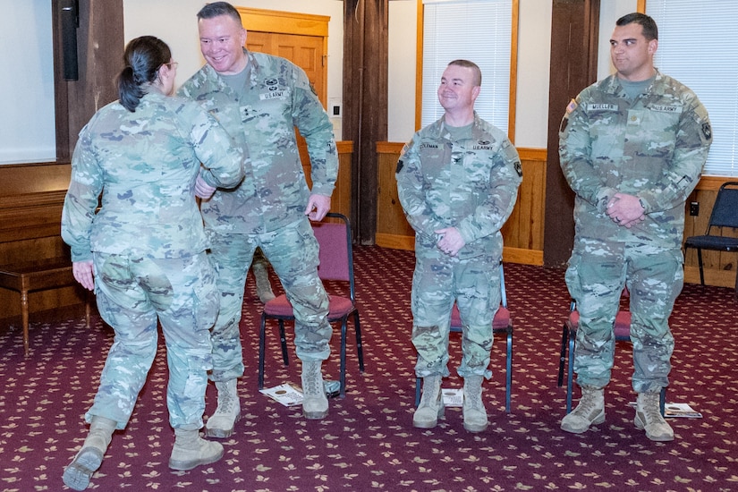 Ten Pennsylvania National Guard Soldiers from the 109th Mobile Public Affairs Detachment, 213th Regional Support Group were honored in a departure ceremony conducted at the Keystone Conference Center Dec. 13. The unit will deploy to Europe in support of U.S. Special Operations Command Europe. (Pennsylvania National Guard photo by Wayne V. Hall)