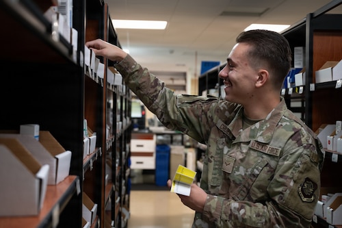U.S. Air Force Airman 1st Class Lucas Crider, 6th Medical Support Squadron pharmacy technician, restocks medication at MacDill Air Force Base, Florida, Oct. 20, 2025. The pharmacy promotes mission readiness and upholds the health of all wing personnel by providing necessary pharmaceutical care and services. (U.S. Air Force photo by Airman 1st Class Autumn Lindor)