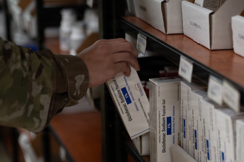A 6th Medical Support Squadron pharmacy technician restocks medication at MacDill Air Force Base, Florida, Oct. 20, 2025. The pharmacy promotes mission readiness and upholds the health of all wing personnel by providing necessary pharmaceutical care and services. (U.S. Air Force photo by Airman 1st Class Autumn Lindor)